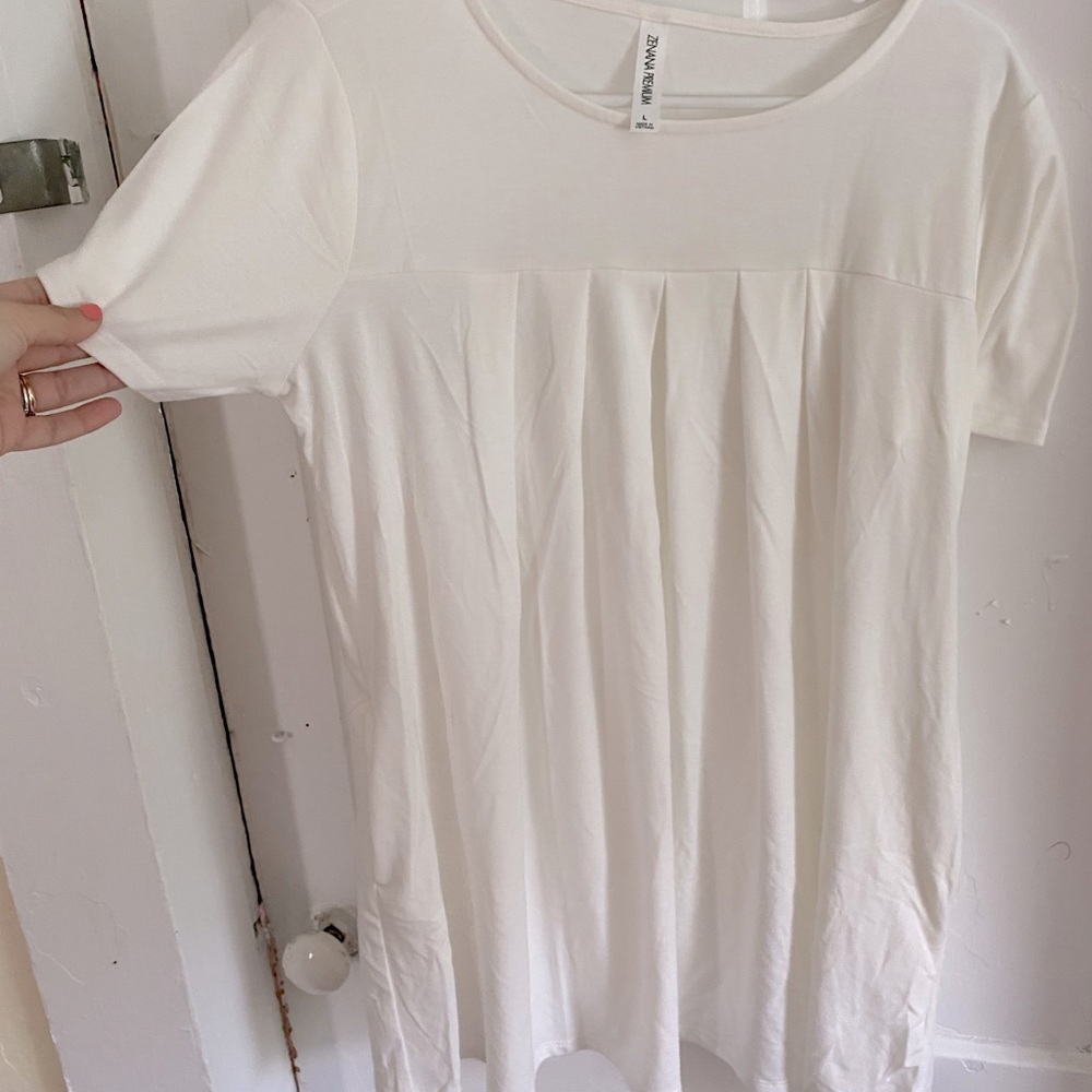 Large white blouse.